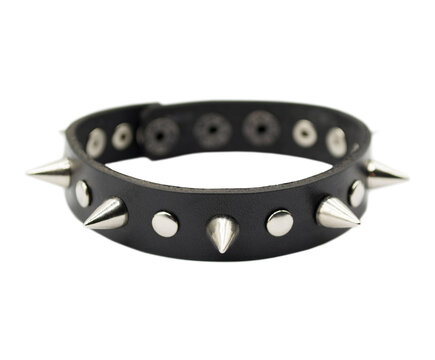 Black leather bracelet with spikes, holnitenes. An accessory for rockers, bikers, metalheads, goths and punks. Steampunk style. Close-up subject photography.