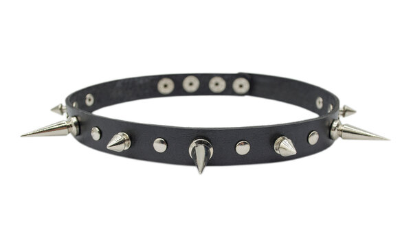 Black leather bracelet with spikes, holnitenes. An accessory for rockers, bikers, metalheads, goths and punks. Steampunk style. Close-up subject photography.