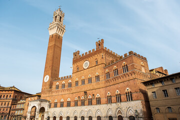 Fototapeta na wymiar The Palazzo Pubblico in Piazza del Campo, the central square of Siena, Tuscany, Italy.