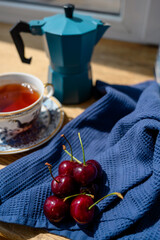 Ripe cherries on a blue towel. Sweet red cherries. Cherries. fruit still life