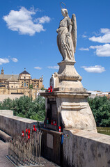 Angel San Rafael statue with views of the cathedral, Cordoba, Spain - obrazy, fototapety, plakaty