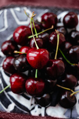 A handful of cherries on a napkin Rustic style Sweet red cherries. Cherries. fruit still life