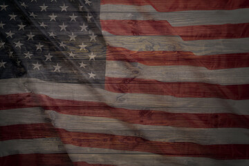 The American flag is on the table. American flag close-up. The star-spangled banner. Official state symbol of the United States. American banner. Memorial Day, Veterans Day, Labor Day.