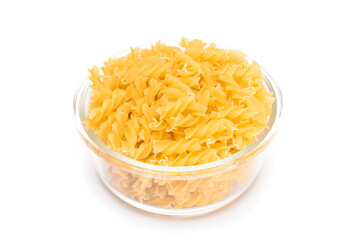 Uncooked Fusilli Pasta in Glass Jar Isolated on White Background. Fat and Unhealthy Food. Classic Dry Spiral Macaroni. Italian Culture and Cuisine. Raw Pasta