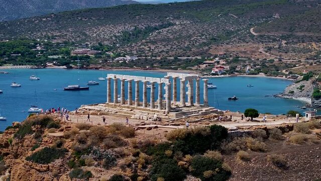Aerial closeup view of the Temple of Poseidon at Cape Sounion at the edge of Attica, Greece, during summer time