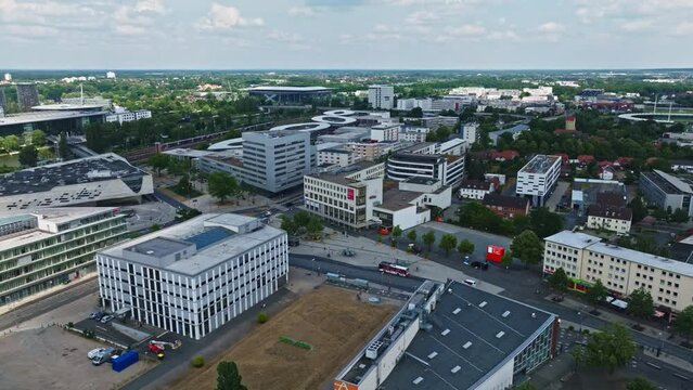 Drone shot of Wolfsburg city , Germany . It's known as the headquarters for Volkswagen and for the Autostadt, an automobile-themed park with a classic-car museum and driving track.