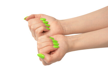 Hand of a woman with green naols hold some tiny or thin object.