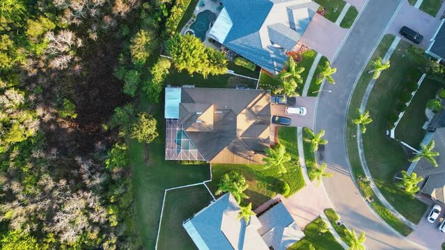 Top down view of Florida Home with Pool enclosure in neighborhood near Tampa florida from 4K aerial drone	
