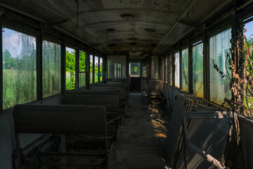 interior of abandoned tram bus in depot