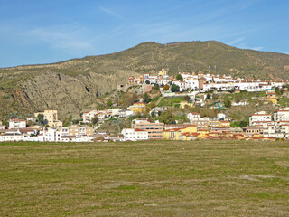 Fototapeta na wymiar Cenes de la Vega and Mountains of the Sierra Nevada above Granada in Spain 