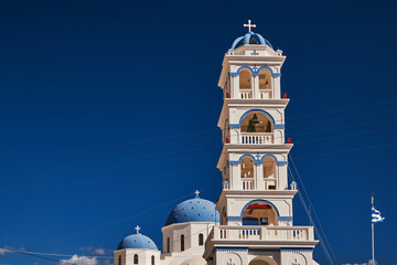 Church of the Holy Cross with a Blue Dome and an Huge Bell Tower - Perissa, Santorini, Greece