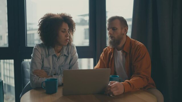 Couple getting bad news, rejected visa application, lost lawsuit, job refusal