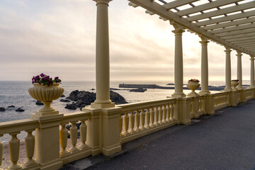 beautiful pergola on Foz promenade in Porto Portugal on seaside at sunset