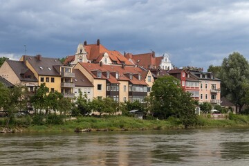 Historical residential buildings on one of the Danube River islands in Regensburg, Germany