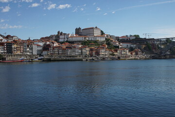 Fototapeta na wymiar The City of the Porto (Oporto), the second largest city in Portugal located on the River Douro, with barges carrying Port (fortified wine)