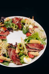 Roastbeef salad on a white plate