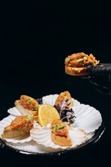 Tartar in hand over the dish