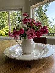 Pink roses in a white vase