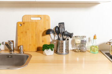 Obraz na płótnie Canvas Scandinavian classic minimalistic kitchen with white and wooden details. Modern white kitchen clean contemporary style interior design
