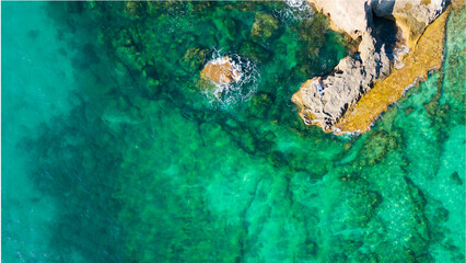 Italy, July 2023: aerial view from the drone of the caribbean sea with colors ranging from...