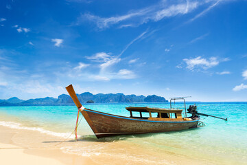 long tail boat on tropical beach