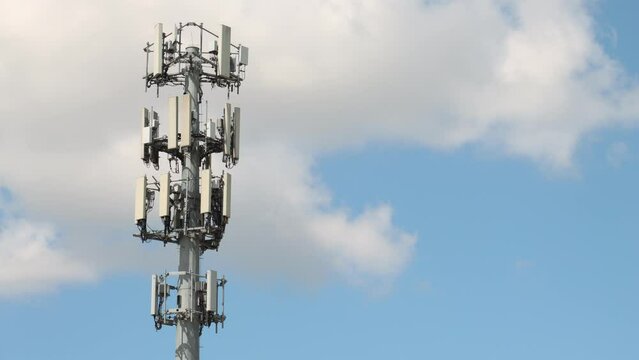 Cellphone tower communications telecom 4G internet timelapse clouds sunny day