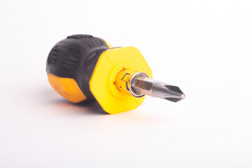 black yellow short screwdriver isolated on white background