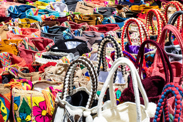 Street selling in Bogota of traditional bags hand knitted by women of the Wayuu community in Colombia called mochilas