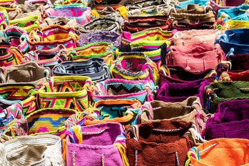 Street selling in Bogota of traditional bags hand knitted by women of the Wayuu community in Colombia called mochilas