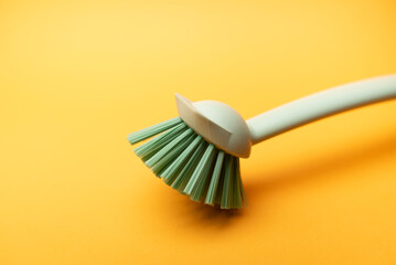 dish brush on yellow background