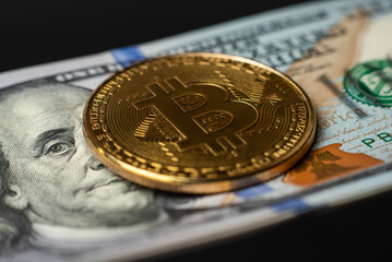 Bitcoin and dollars close up