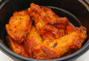 Chicken wings with sauce on white background 