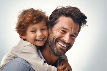 Happy father and his son hugging and looking at camera isolated on grey. Ai generated.