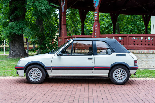 Peugeot 205 CTI (CJ or CT) cabriolet (convertible) in white color, Side view. Palic, Serbia 02.07.2023