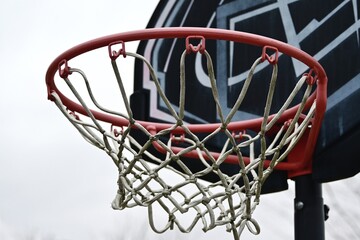 Fototapeta na wymiar Basketball Hoop and Clouds