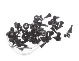 Fastener plastic clip fly explosion, black automobile fastener clip float explode, abstract cloud fly. automobile plastic fastener clip splash throwing in Air. White background Isolated