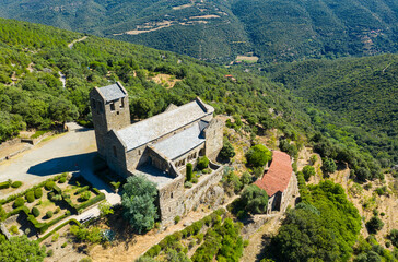 Scenic aerial view of ancient Romanesque building of Serrabone Priory in foothills of Canigou in...
