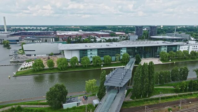 Drone shot of a modern glass building in autostadt , Wolfsburg , Germany