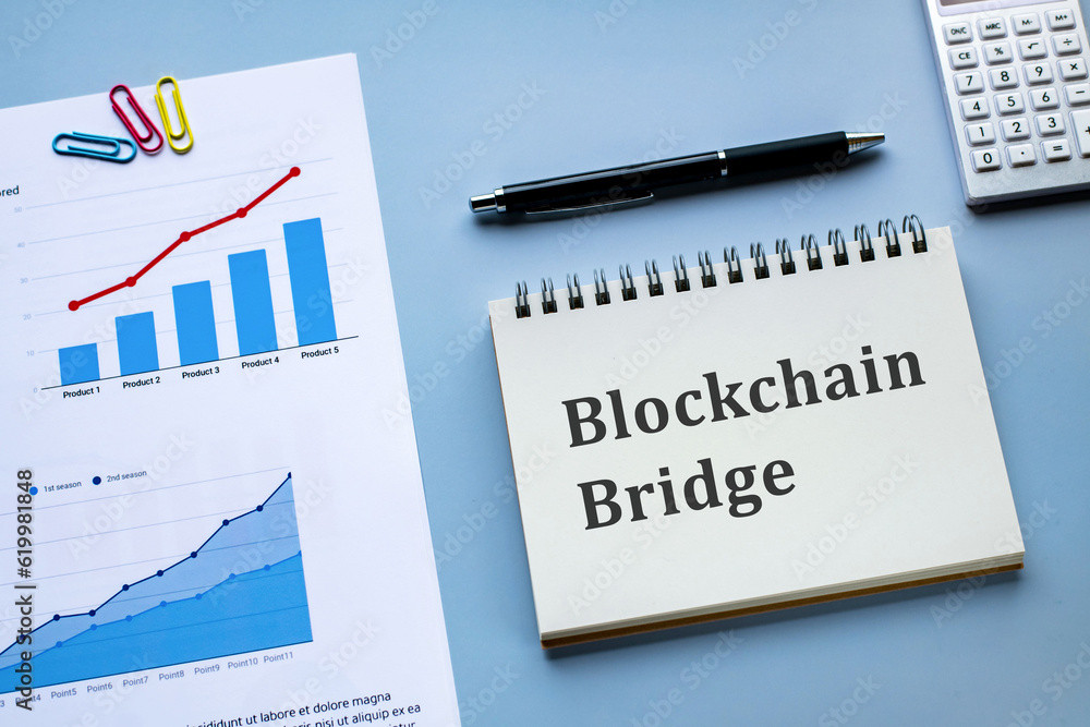 Poster there is notebook with the word blockchain bridge. it is as an eye-catching image.