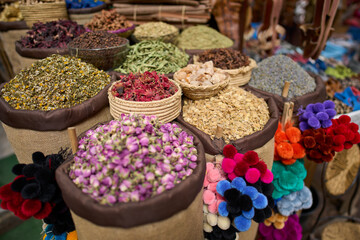 Exotic colorful spices and herbs in Moroccan street market in the Medina of Marrakesh. Vacation in...