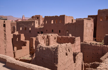 Ruins of village ksar Afanour near Tinghir, Atlas Mountains. Houses built of red clay, traditional construction material in region, and eroded by time. Photo taken before earthquake of September 2023.