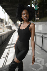 Fashion outdoor street style portrait Beautiful young African American woman posing outside on...