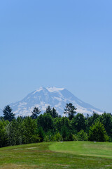 Scenic tee box on a public golf course, Mount Rainier in the background, recreation on a sunny summer day
