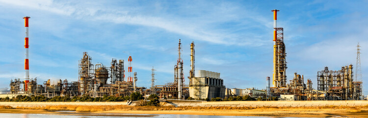 The petrochemical complex at Yokkaichi Port with blue sky background.