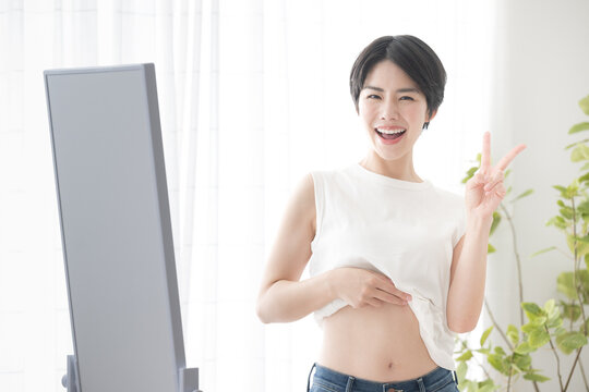 Woman with a cheerful image, such as a successful diet Peace Looking at the camera