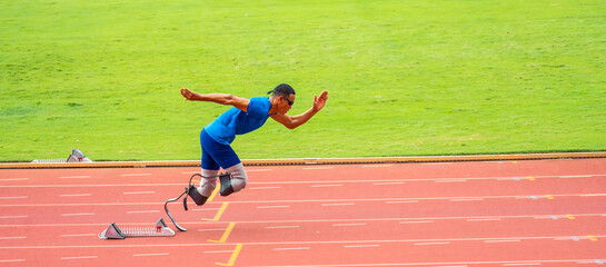 Asian para-athletes disabled with prosthetic blades running at stadium.