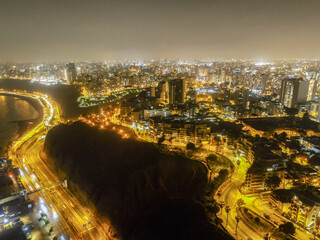 Drone panorama of lima skyline by night