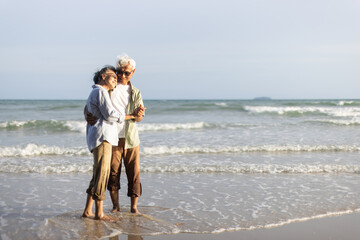 Retired couple dances happily. Plan life insurance and retirement concept.
