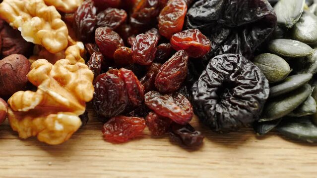 Close up of assorted dried fruits and nuts. Natural food background.