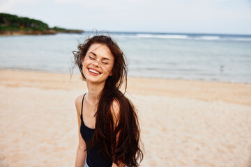 Fototapeta na wymiar beach woman sea vacation smile space summer ocean sand nature copy young